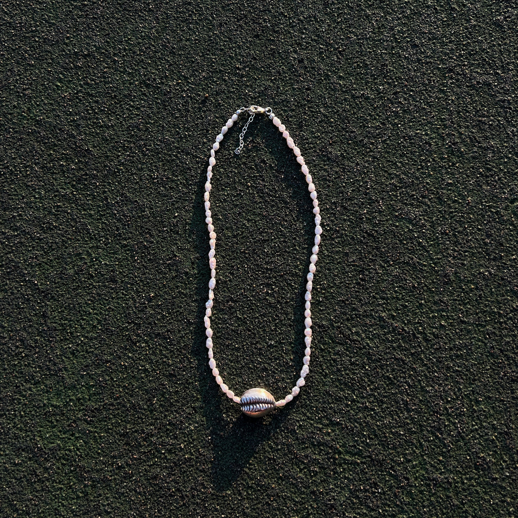 Naya freshwater pearl necklace with sterling silver cowrie shell