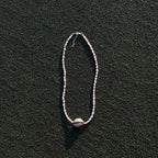 Naya freshwater pearl necklace with sterling silver cowrie shell