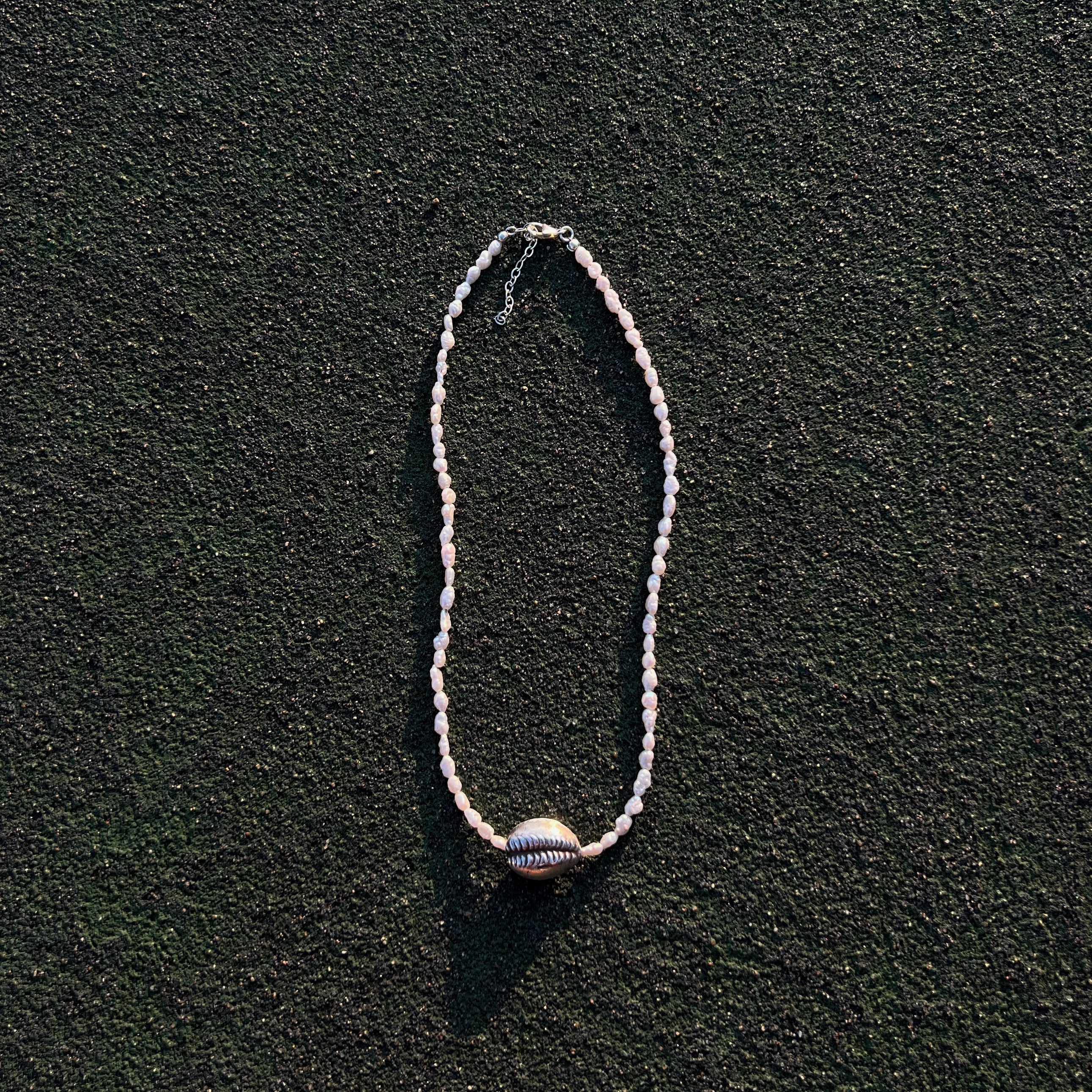Naya freshwater pearl necklace with sterling silver cowrie shell
