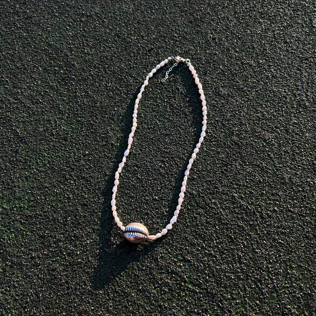 Naya freshwater pearl necklace with sterling silver cowrie shell