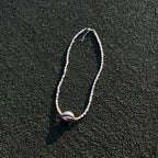 Naya freshwater pearl necklace with sterling silver cowrie shell