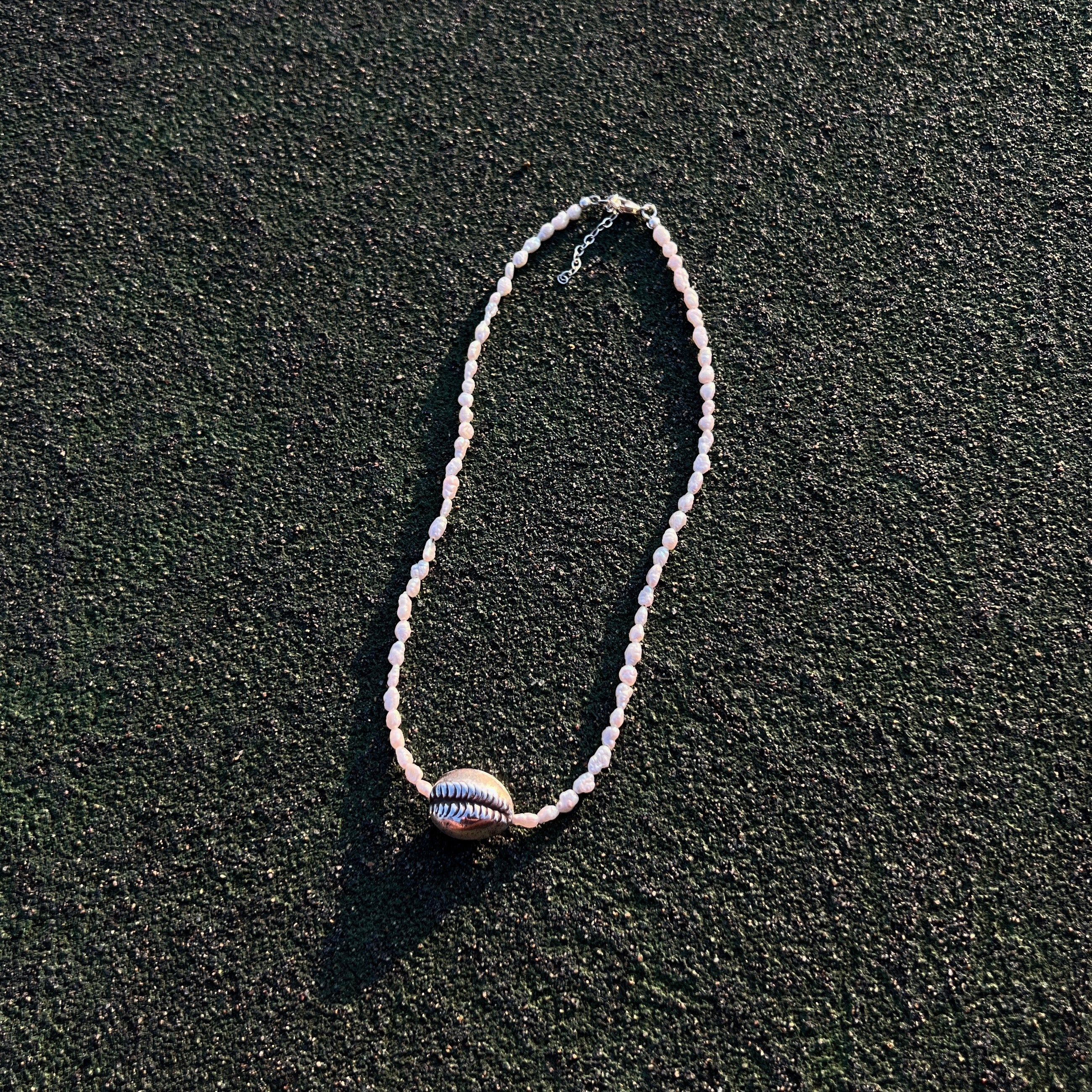 Naya freshwater pearl necklace with sterling silver cowrie shell