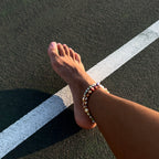 Model wearing Colorful freshwater pearl necklace. Can be worn as an anklet